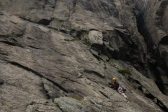 arriving under the overhanging, hard pitches. Since we were constantly wetted by rainshowers and cooled by strong winds we bailed at this point
